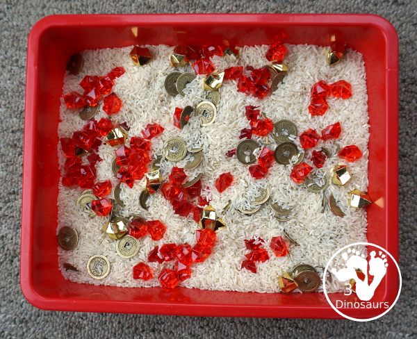 Lunar New Year Sensory Bin - a fun sensory bin with rice, coins, and red rocks for a simple and easy to put together sensory bin for Chinese New year or Lunar New Year- 3Dinosaurs.com