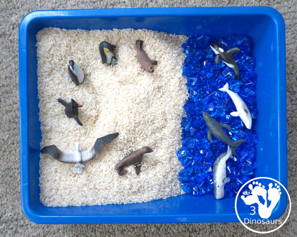 Antarctic Sensory Bin - a simple Antarctic sensory bin with animals, rice and acrylic blue rocks. Easy to set up and play time for kids - 3Dinosaurs.com