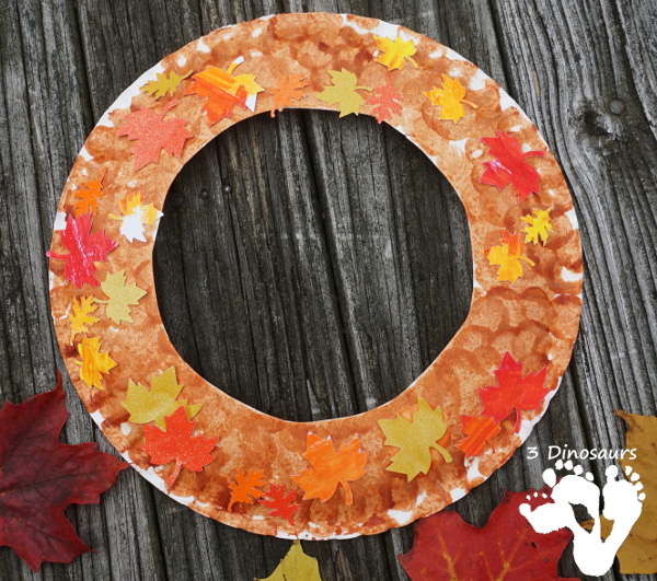 Fall Leaf Themed Wreath - fun wreath that kids can make with oil pastels and leaf punches - 3Dinosaurs.com 