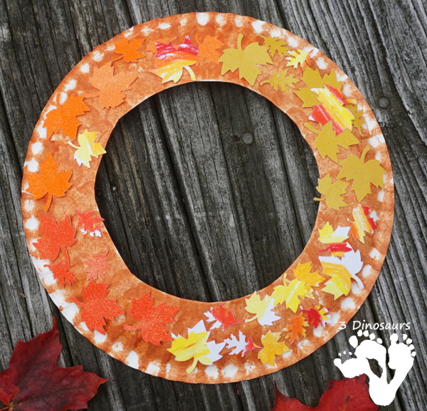 Fall Leaf Themed Wreath - fun wreath that kids can make with oil pastels and leaf punches - 3Dinosaurs.com 