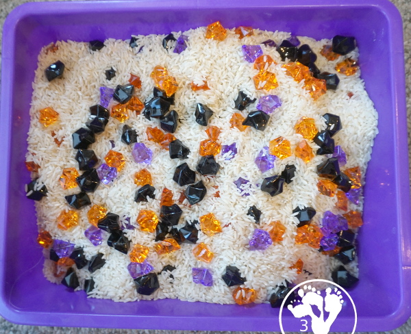 Halloween Black, Orange, and Purple Sensory Bin - a fun rice base sensory bin with colors black, orange and purple for the colors.- 3Dinosaurs.com