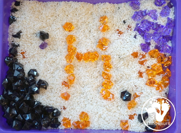 Halloween Black, Orange, and Purple Sensory Bin - a fun rice base sensory bin with colors black, orange and purple for the colors.- 3Dinosaurs.com