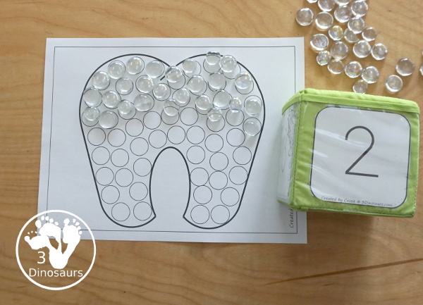 Free Tooth Fine Motor Dot Marker Printables -  with four pages of printables with a tooth template to color, a tooth to trace and a dot marker tooth, all great for dental health fine motor centers. -3Dinosaurs.com