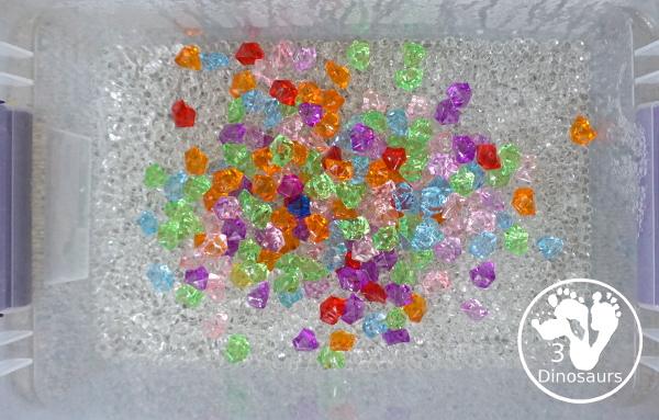 Rainbow Colors Water Bead Sensory Bin - a great sensory bin exploring colors through clear water beads a fun sensory play for kids to do. - 3Dinosaurs.com