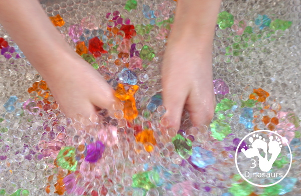 Rainbow Colors Water Bead Sensory Bin - a great sensory bin exploring colors through clear waterbeads a fun sensory play for kids to do. - 3Dinosaurs.com