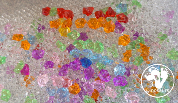 Rainbow Colors Water Bead Sensory Bin - a great sensory bin exploring colors through clear waterbeads a fun sensory play for kids to do. - 3Dinosaurs.com