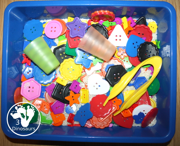 Shape Button Sensory Bin - a simple sensory bin made with rice base and different sizes of shape buttons. An easy shape sensory bin for prek and kindergarten. - 3Dinosaurs.com