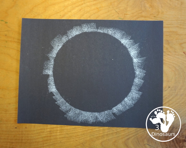 Total Solar Eclipse Pastel Craft - made with a black construction paper and a white chalk pastel - 3Dinosaurs.com