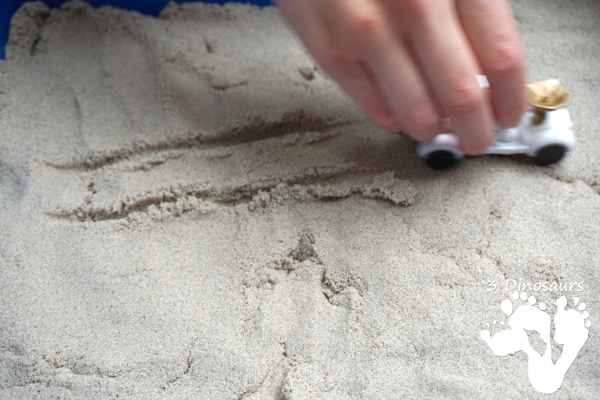 Kinetic Sand Space Moon Walking Sensory Bin - an easy way to explore the moon landing and have sensory fun - 3Dinosaurs.com