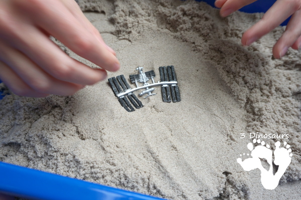 Kinetic Sand Space Moon Walking Sensory Bin - an easy way to explore the moon landing and have sensory fun - 3Dinosaurs.com