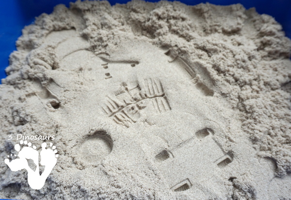 Kinetic Sand Space Moon Walking Sensory Bin - an easy way to explore the moon landing and have sensory fun - 3Dinosaurs.com