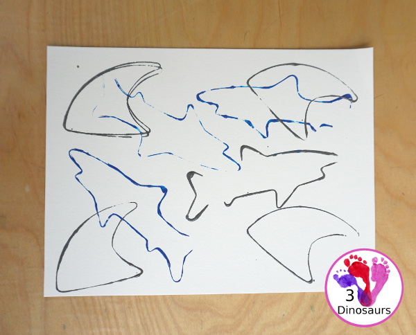 Shark Cookie Cutter Painting - a great painting activity for kids of all ages and works great with tot and preschool age kids for a shark paint activity - 3Dinosaurs.com