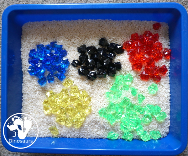 Olympic Flag Colors Sensory Bin - a simple sensory bin to explore the different colors that make the rings on the Olympic Flag - 3Dinosaurs.com