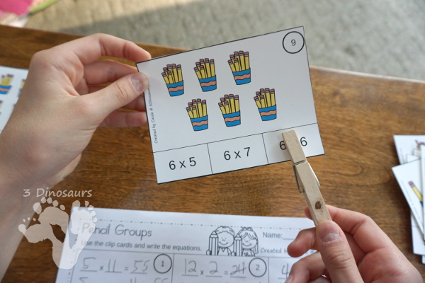 Free Pencil Groups Multiplication Clip Cards - 12 clip cards with matching worksheet - 3Dinosaurs.com #clipcards #freeprintable #multiplication #backtoschool