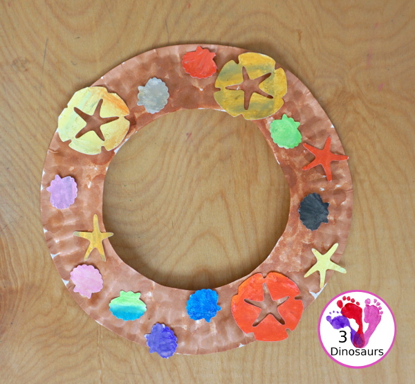 Beach Wreath Craft for Kids - a super easy to make beach craft with a wreath and shells kids can color and punch out to make the beach wreath. - 3Dinosaurs.com