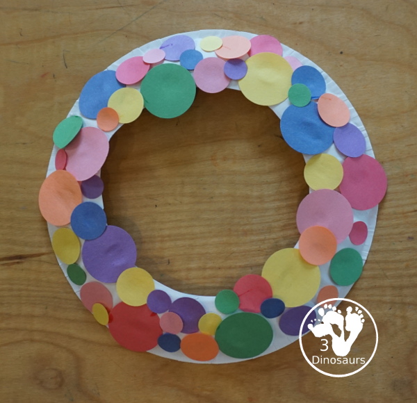 Circle Wreath Craft for Dot Day - a fun paper plate wreath with different colors of circles glued on the wreath - 3Dinosaurs.com
