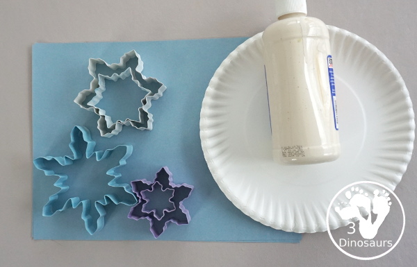 Making Snowflakes - Snowflake Cookie Cutter Painting - a simple painting craft that different ages of kids can do - 3Dinosaurs.com