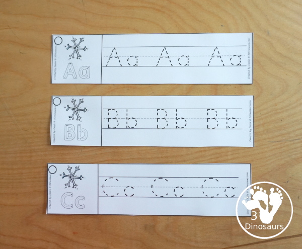 Free Snowflake Theme ABC Tracing Strips - with uppercase and lowercase together. You have fun kids with a snowflake plus you can see an example of how to trace the letters - 3Dinosaurs.com