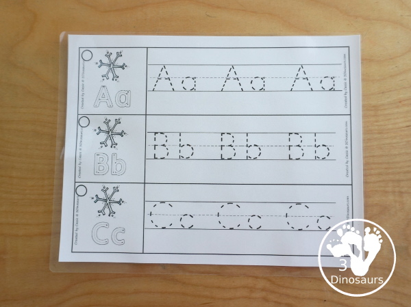 Free Snowflake Theme ABC Tracing Strips - with uppercase and lowercase together. You have fun kids with a snowflake plus you can see an example of how to trace the letters - 3Dinosaurs.com