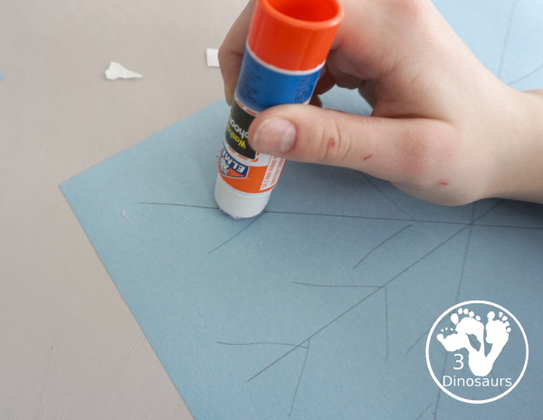 Torn Paper Snowflakes - a fun torn paper winter craft that kids can do and have a blast making - 3Dinosaurs.com