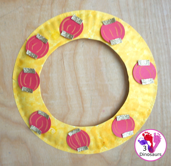 Lunar New Year Wreath Craft for kids - a simple paper plate wreath you can make with kids for the lunar new year and Chinese New year with a red lantern theme  - 3Dinosaurs.com