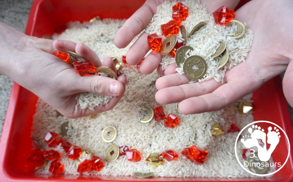 Lunar New Year Sensory Bin - a fun sensory bin with rice, coins, and red rocks for a simple and easy to put together sensory bin for Chinese New year or Lunar New Year- 3Dinosaurs.com