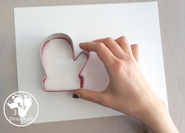 Mitten Cookie Cutter Stamp Painting - a simple winter painting that kids can do with a mitten cookie cutter. - 3Dinosaurs.com
