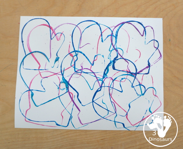 Mitten Cookie Cutter Stamp Painting - a simple winter painting that kids can do with a mitten cookie cutter. - 3Dinosaurs.com