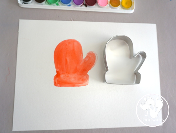 Mitten Watercolor Painting With Cookie Cutters - A simple painting you can do with kids of different ages by painting inside a cookie cutter to make a fun mitten painting - 3Dinosaurs.com