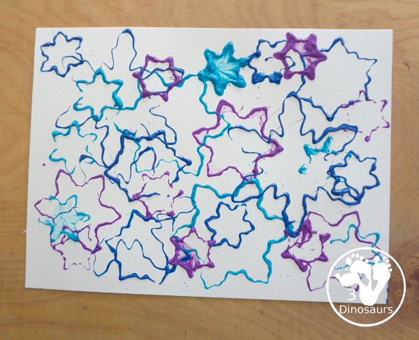 Colored Snowflake Cookie Cutter Stamping - A simple stamp painting with cookie cutters. You have several sizes and different colors of blues and purple - 3Dinosaurs.com