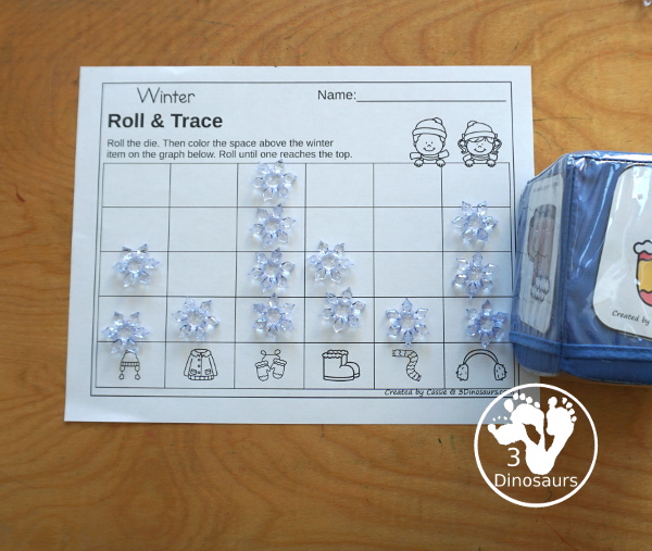 Winter Roll & Graph With Trace Letters, Numbers & Shapes with a folding die and cube die with a graphing sheet, graphing with tracing numbers, graphing with tracing letters and graphing with tracing shapes. All with a fun winter clothes theme for winter for prek and kindergarten - 3Dinosaurs.com