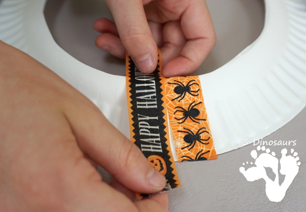 Fun Fine Motor Craft: Washi Tape Halloween Wreath - kids will get will work on fine motor skills while making a fun wreath for Halloween. - 3Dinosaurs.com