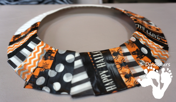 Fun Fine Motor Craft: Washi Tape Halloween Wreath - kids will get will work on fine motor skills while making a fun wreath for Halloween. - 3Dinosaurs.com