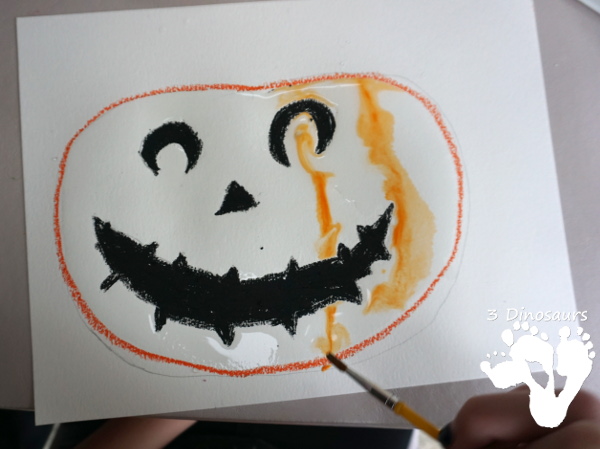 Watercolor Process Art Jack-O-Lantern - a fun Halloween painting activity to do with kids. It is great for kids that love to be creative and do things their own way - 3Dinosaurs.com 