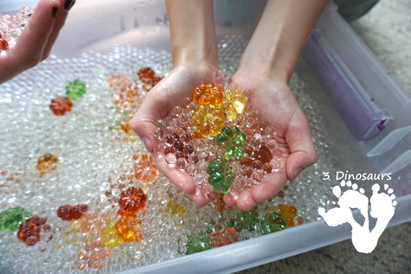 Pumpkin Water Beads Sensory Bin - fun sensory play with clear water beads and acrylic pumpkins make a fun sensory play for the fall - 3Dinosaurs.com