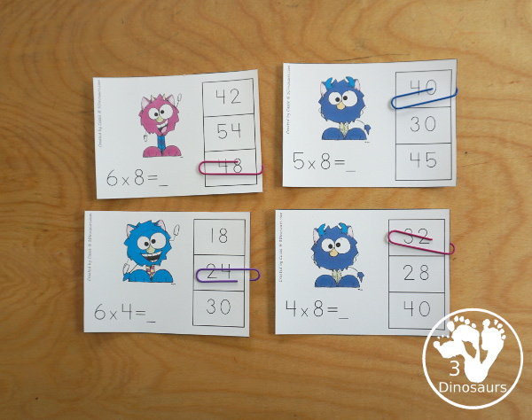 Free Monster Multiplication Clip Cards - with multiplication from 1 to 12 for kids to work on clipping the correct answer for the multiplication with 4 cards for each number with 12 pages of printables - 3Dinosaurs.com