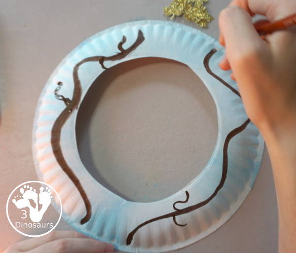 Fall Leaf Wreath Craft for Kids with a watercolor painted paper plate and leaves made from glitter paper - 3Dinosaurs.com