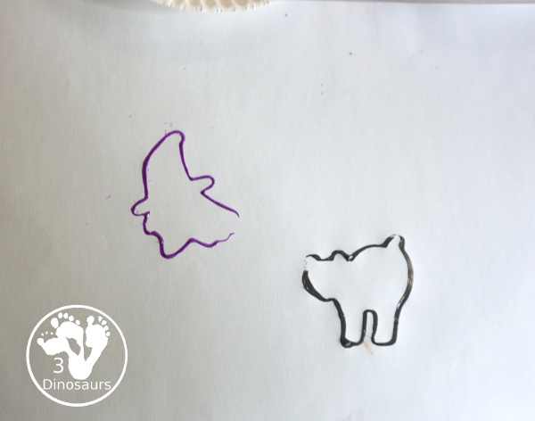 Halloween Stamping With Cookie Cutters - painting with cookie cutters using them to stamp paint with the cookie cutters on a piece of paper. A great tot, preschool and prek painting activity - 3Dinosaurs.com