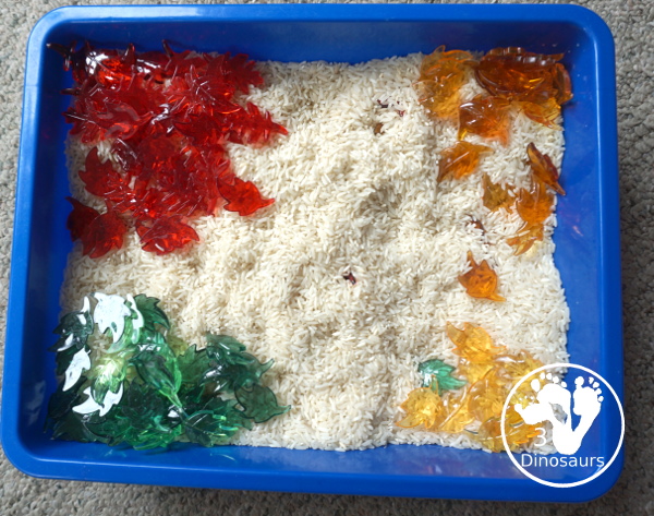 Fall Leaves Sensory Bin - a simple fall leaf sensory bin with different colors of leaves with red, yellow, orange, and green leaves. The sensory bin as a rice filler. - 3Dinosaurs.com