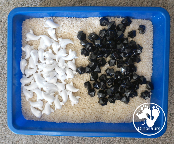 Ghost Sensory Bin - a simple ghost sensory bin with ghost, black rocks and a rice filler for this simple Halloween Sensory bin- 3Dinosaurs.com