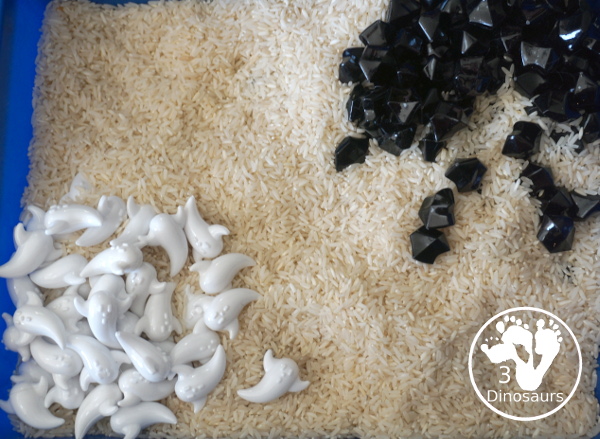 Ghost Sensory Bin - a simple ghost sensory bin with ghost, black rocks and a rice filler for this simple Halloween Sensory bin- 3Dinosaurs.com