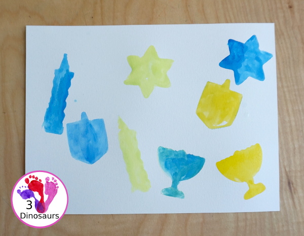 Hanukkah Watercolor Cookie Cutter Painting - a simple watercolor painting for Hanukkah using Hanukkah themed cookie cutters - 3Dinosaurs.com