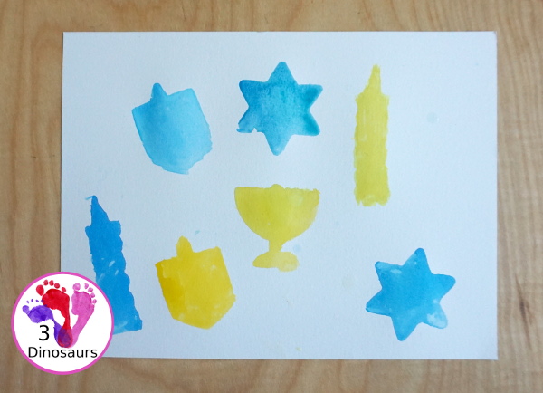 Hanukkah Watercolor Cookie Cutter Painting - a simple watercolor painting for Hanukkah using Hanukkah themed cookie cutters - 3Dinosaurs.com