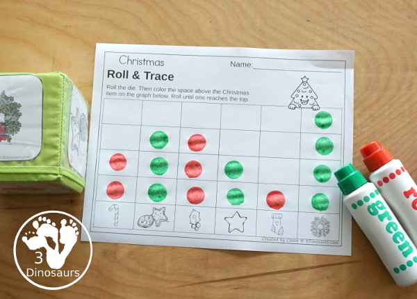 Christmas Roll & Graph With Trace Letters, Numbers & Shapes with a folding die and cube die with a graphing sheet, graphing with tracing numbers, graphing with tracing letters and graphing with tracing shapes. All with a fun holiday theme for Christmas for prek and kindergarten - 3Dinosaurs.com