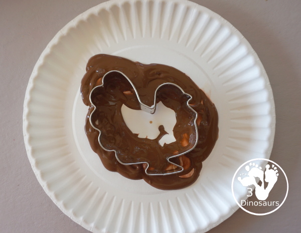 Thanksgiving Cookie Cutter Stamp Painting - with turkey, leaf and pumpkin stamp painting. This is a fun art that different ages can do together. A great process art that can be used as a placemat as well. - 3Dinosaurs.com