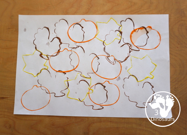 Thanksgiving Cookie Cutter Stamp Painting - with turkey, leaf and pumpkin stamp painting. This is a fun art that different ages can do together. A great process art that can be used as a placemat as well. - 3Dinosaurs.com