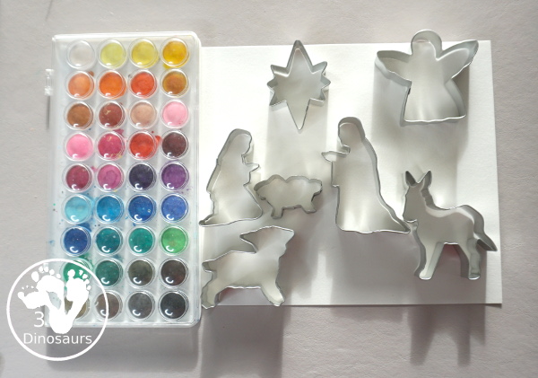 Nativity Watercolor Painting for kids - a simple way to make a Nativity scene with watercolors and cookies cutters. A great way to work on retelling the nativity story - 3Dinosaurs.com