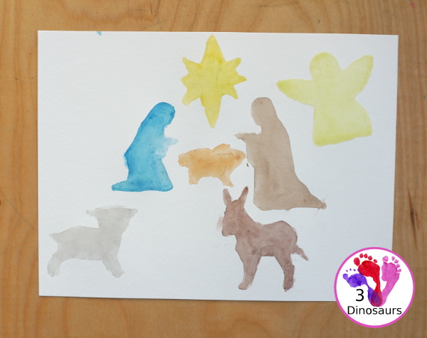 Nativity Watercolor Painting for kids - a simple way to make a Nativity scene with watercolors and cookies cutters. A great way to work on retelling the nativity story - 3Dinosaurs.com