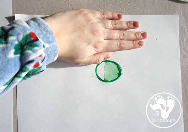 Christmas Tree Paper Roll Painting - a fun painting craft that you can do with kids to make a Christmas tree - 3Dinosaurs.com