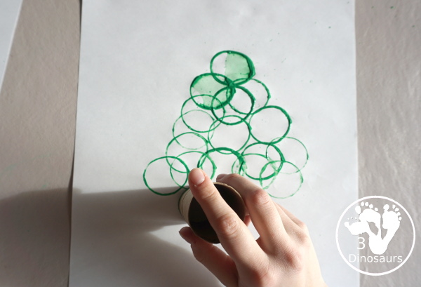 Christmas Tree Paper Roll Painting - a fun painting craft that you can do with kids to make a Christmas tree - 3Dinosaurs.com